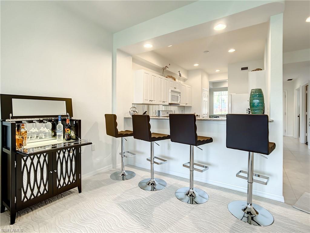 7930 Mahogany Run Lane, Unit 814 Naples, FL 34113 - Photo 13 of 29 a view of a room with gym equipment