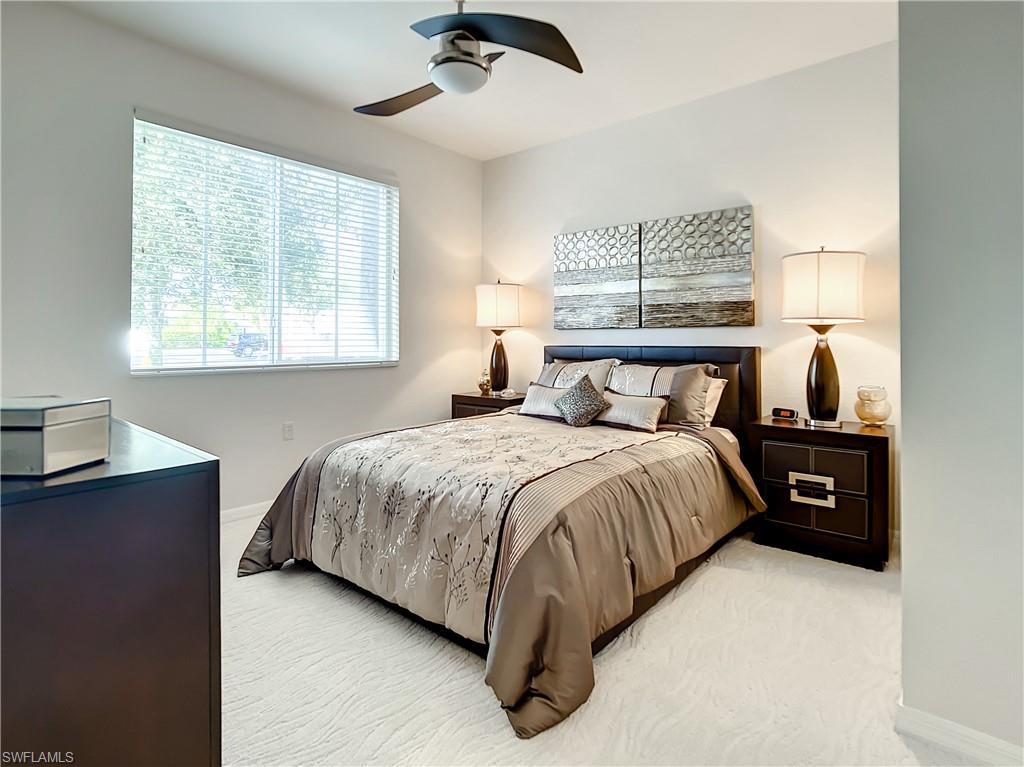 7930 Mahogany Run Lane, Unit 814 Naples, FL 34113 - Photo 24 of 29 a bedroom with a bed and window