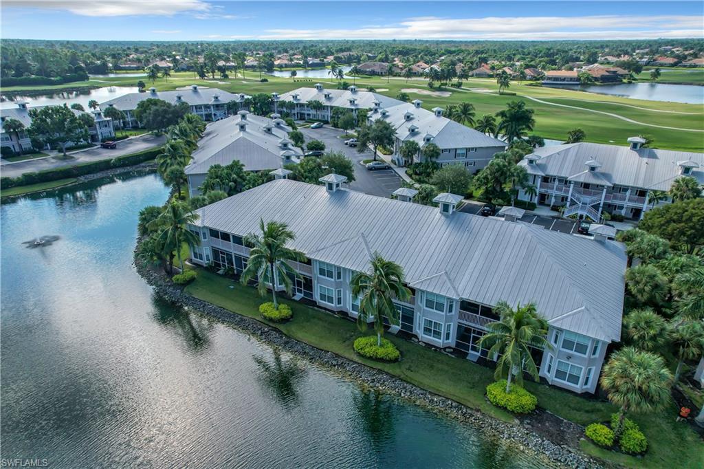 7930 Mahogany Run Lane, Unit 814 Naples, FL 34113 - Photo 25 of 29 an aerial view of a house with garden space and lake view