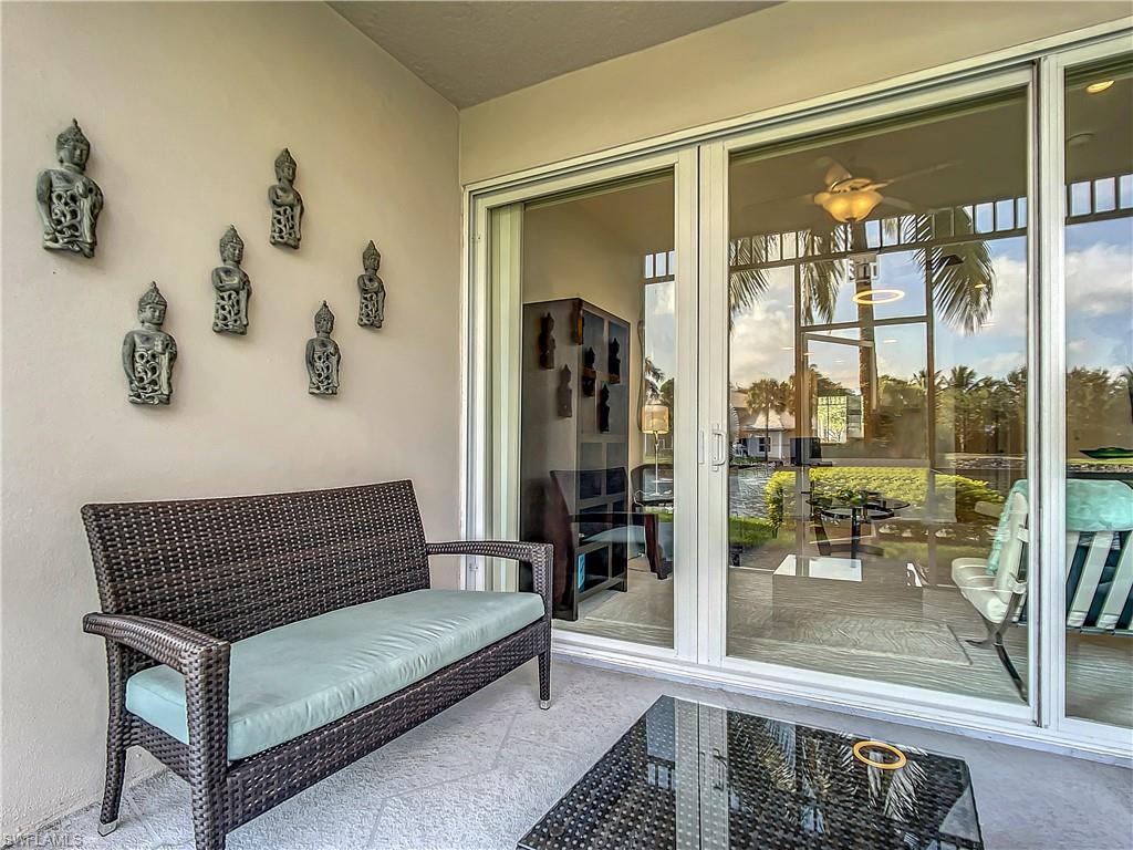 7930 Mahogany Run Lane, Unit 814 Naples, FL 34113 - Photo 4 of 29 a view of a hallway with a couch
