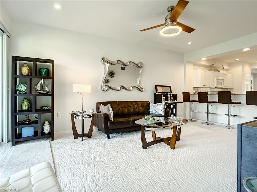 7930 Mahogany Run Lane, Unit 814 Naples, FL 34113 - Photo 9 of 29 a living room with furniture and white walls