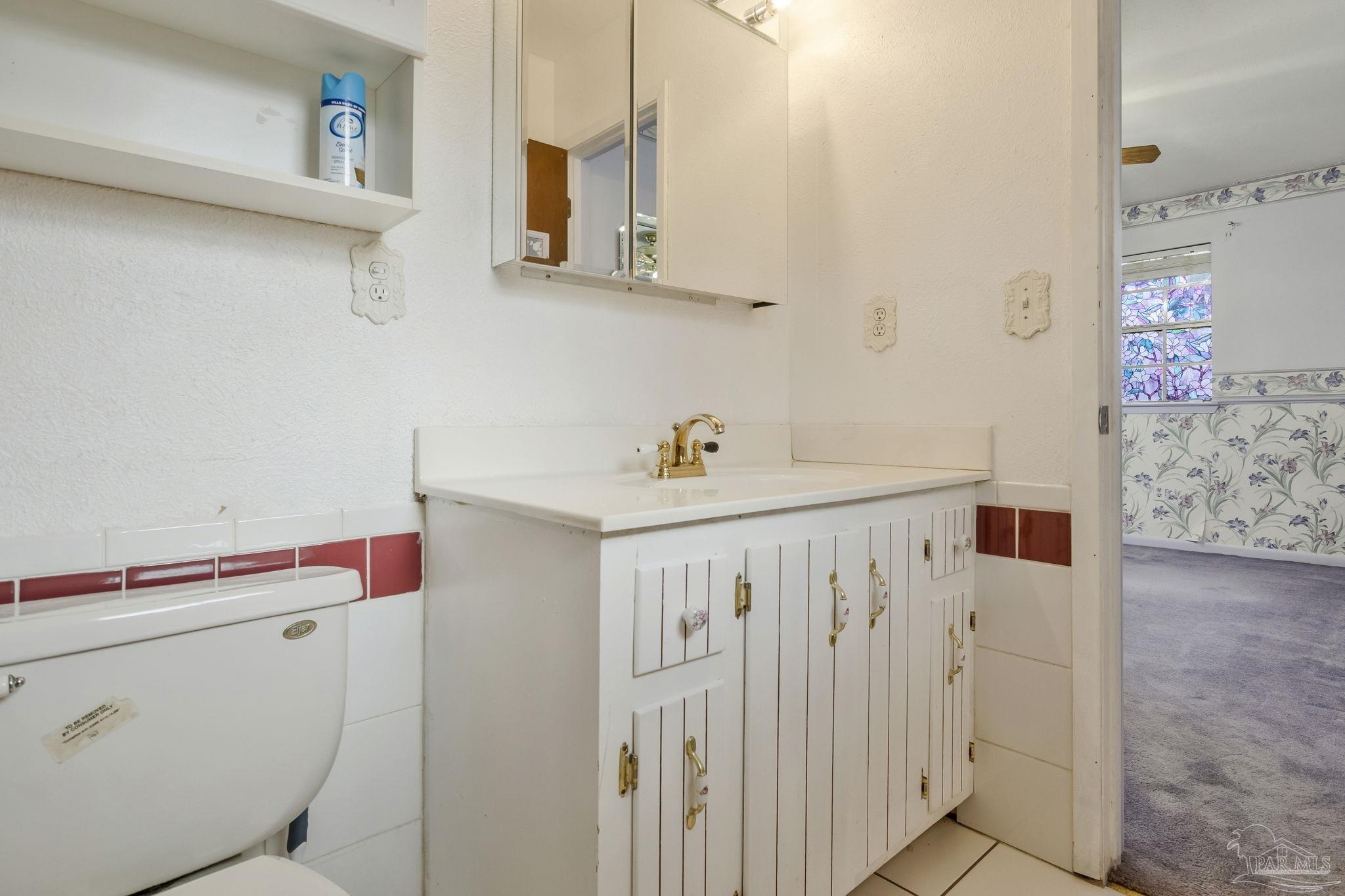 4411 Pace Lane Pace, FL 32571 - Photo 56 of 68 a bathroom with a sink a toilet and shower