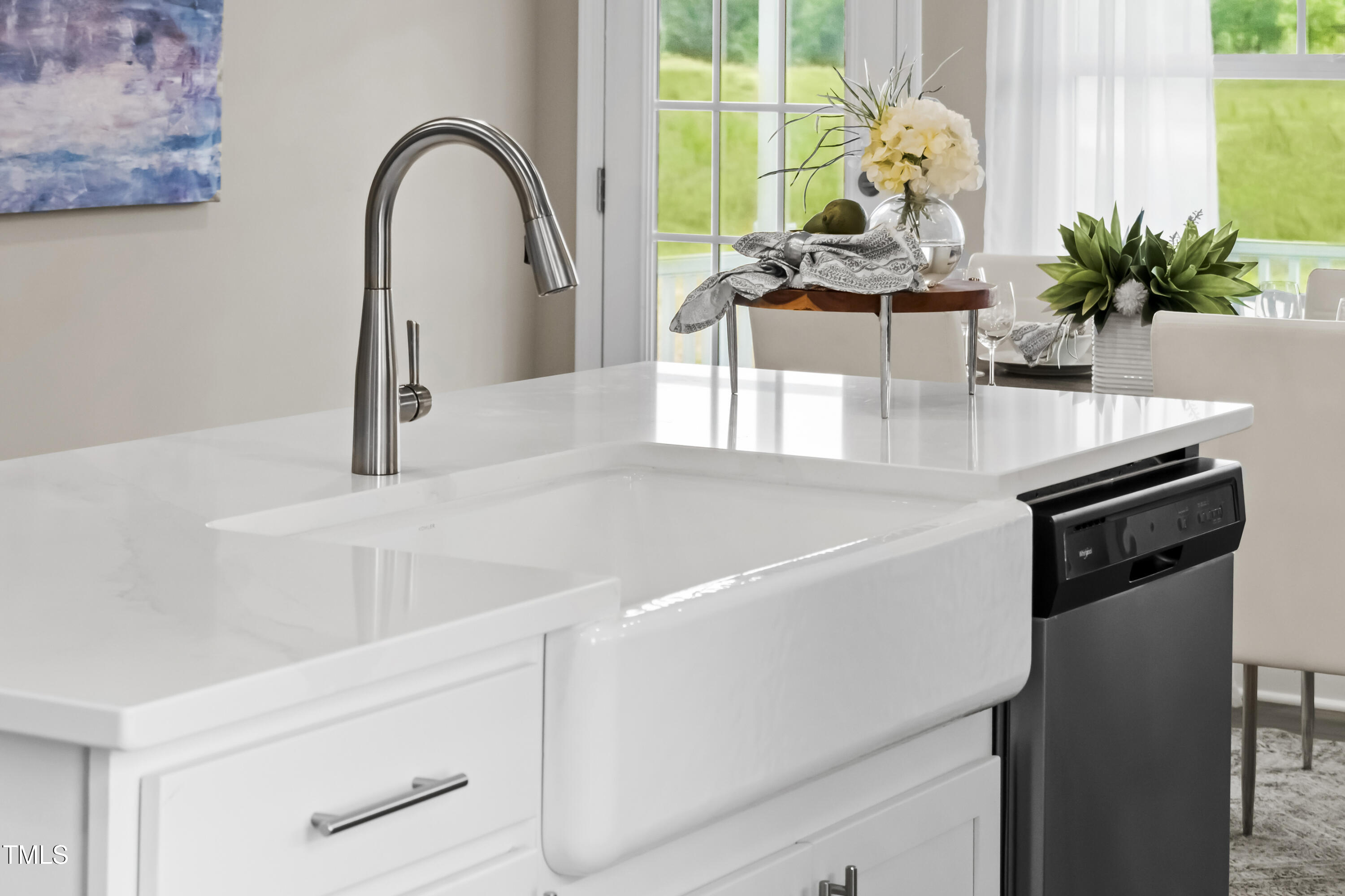 2011 Cross Bones Boulevard, Unit 41 Durham, NC 27703 - Photo 6 of 14 a kitchen with a sink and a potted plant