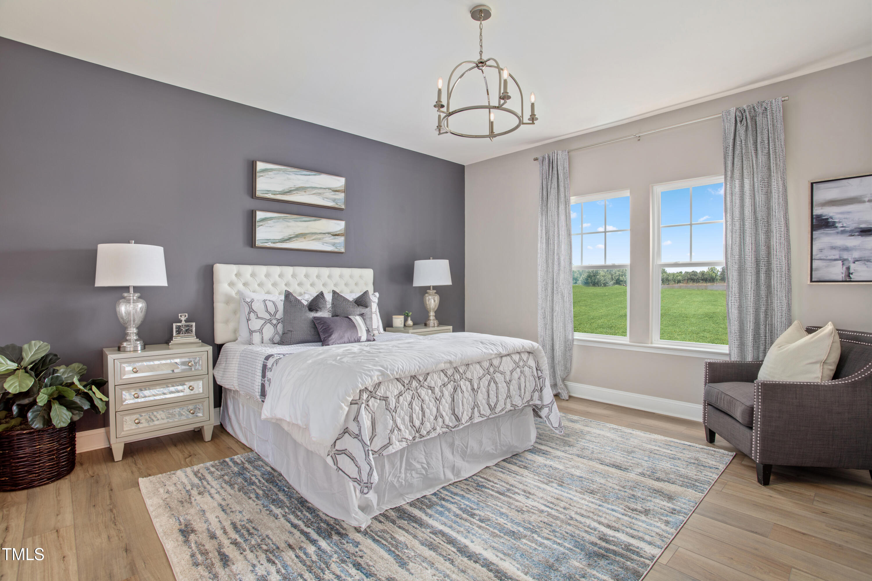 2011 Cross Bones Boulevard, Unit 41 Durham, NC 27703 - Photo 7 of 14 a bedroom with a bed and wooden floor