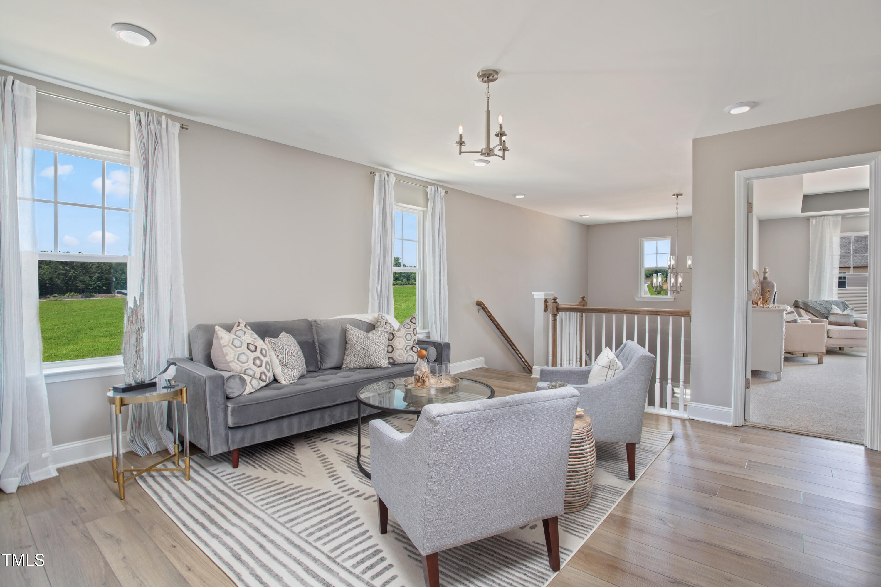 2011 Cross Bones Boulevard, Unit 41 Durham, NC 27703 - Photo 8 of 14 a living room with furniture and a wooden floor