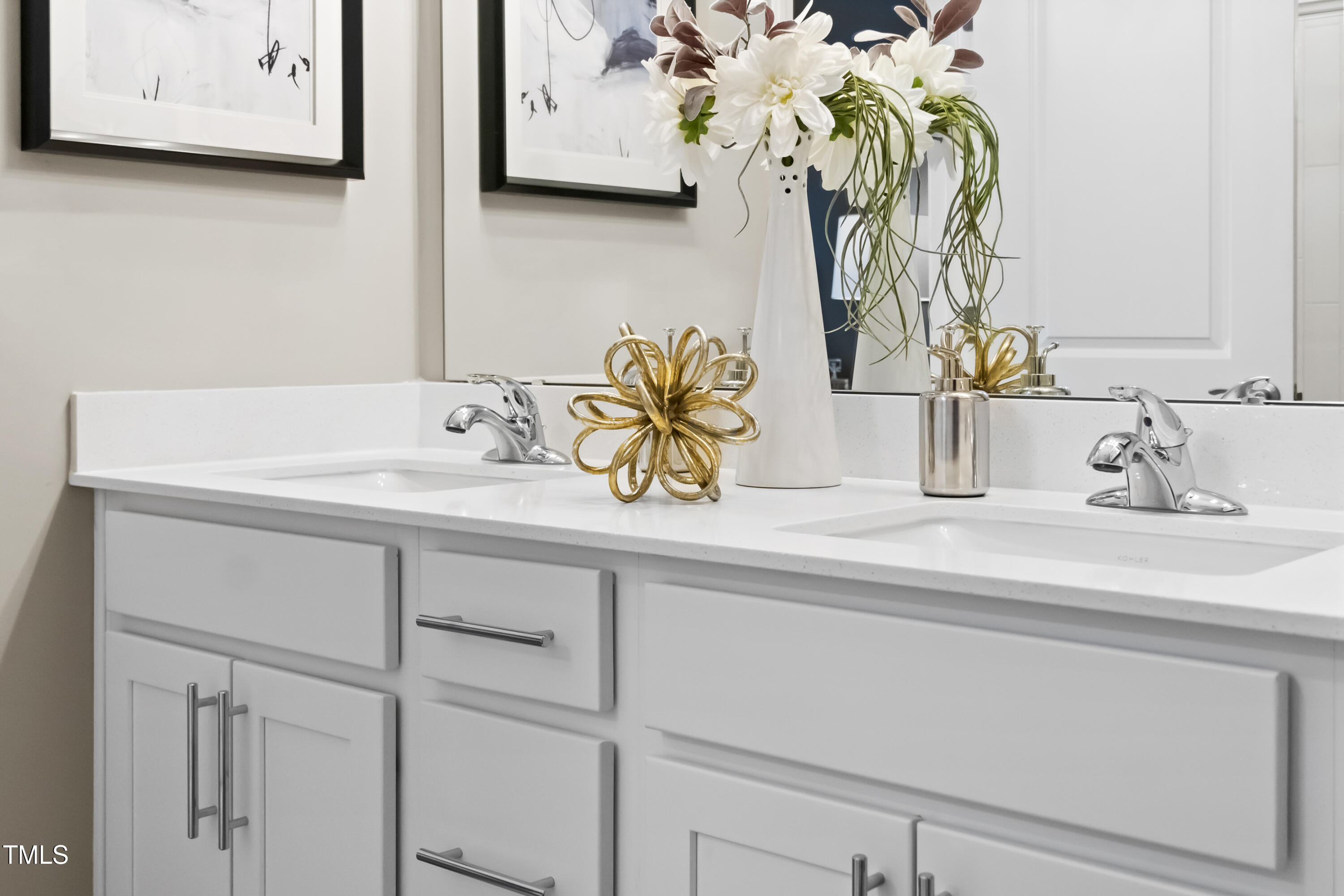 2011 Cross Bones Boulevard, Unit 41 Durham, NC 27703 - Photo 10 of 14 a bathroom with a sink and a mirror