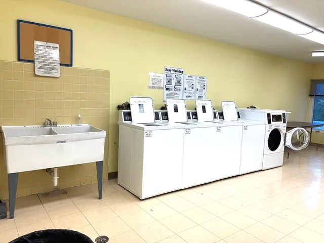 a utility room with a sink a washer and dryer