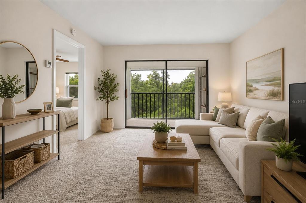 26485 Rampart Boulevard, Unit A27 Punta Gorda, FL 33983 - Photo 2 of 27 a living room with furniture and a large window