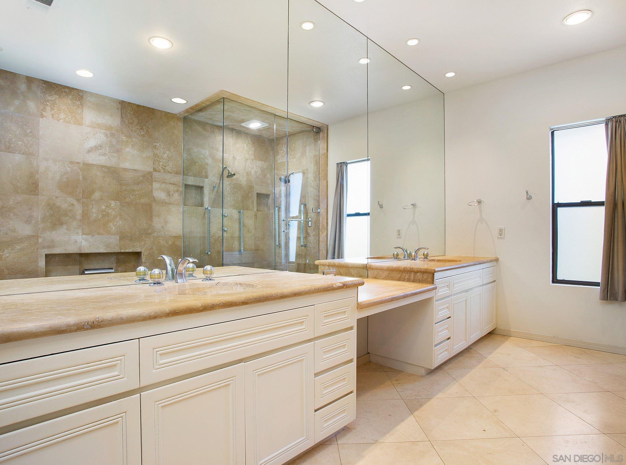 560 Torrey Point Road Del Mar, CA 92014 - Photo 12 of 25 a bathroom with a granite countertop sink mirror and bathtub