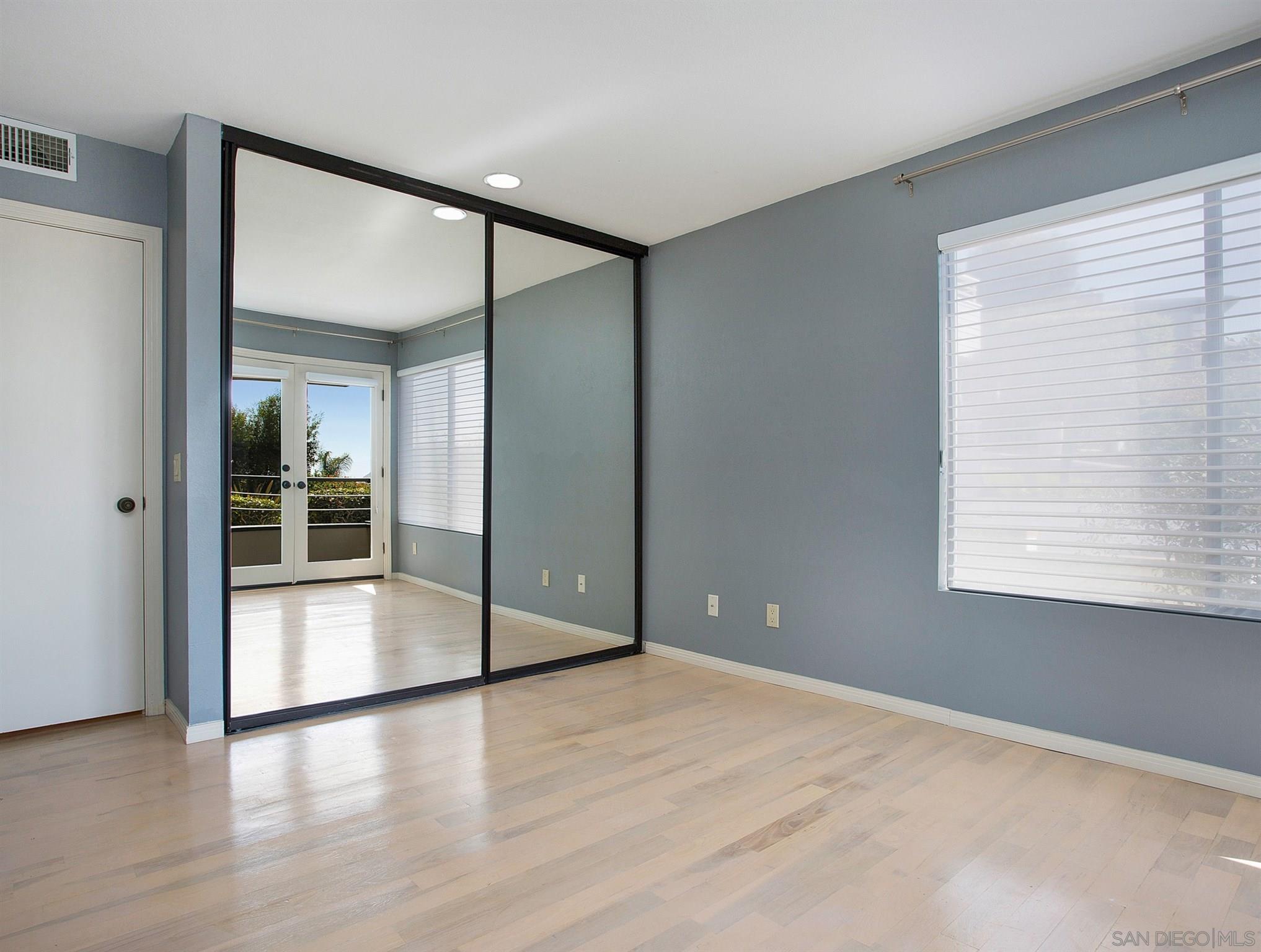 560 Torrey Point Road Del Mar, CA 92014 - Photo 17 of 25 a view of empty room with wooden floor and fan