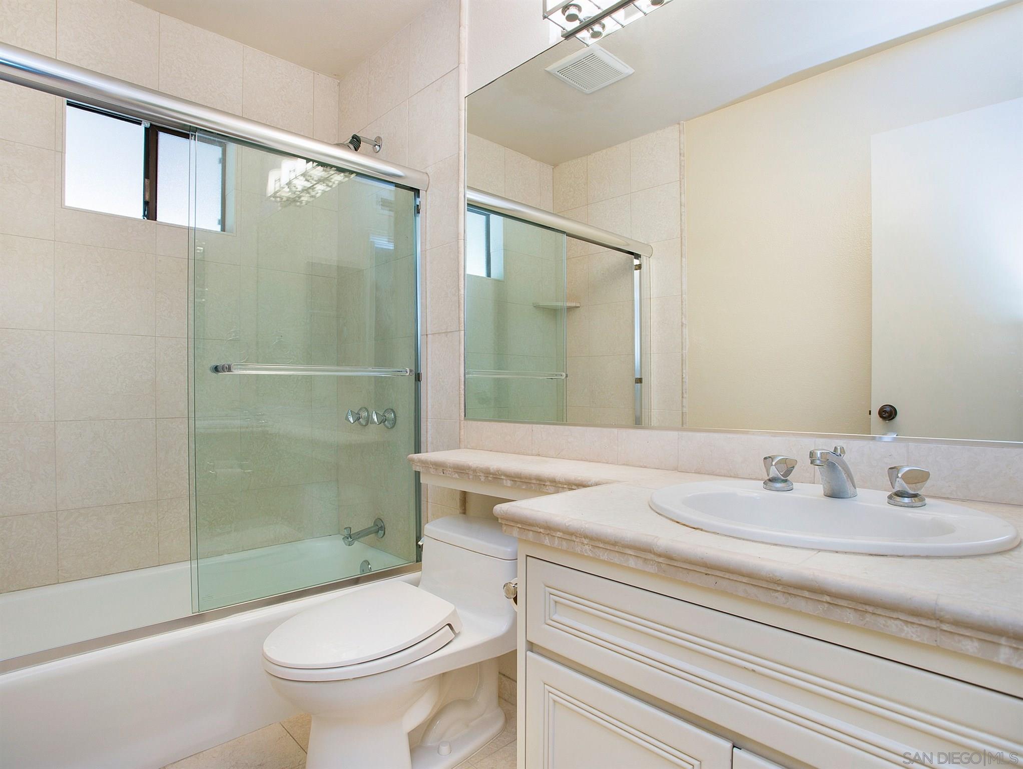 560 Torrey Point Road Del Mar, CA 92014 - Photo 18 of 25 a bathroom with a sink toilet and shower