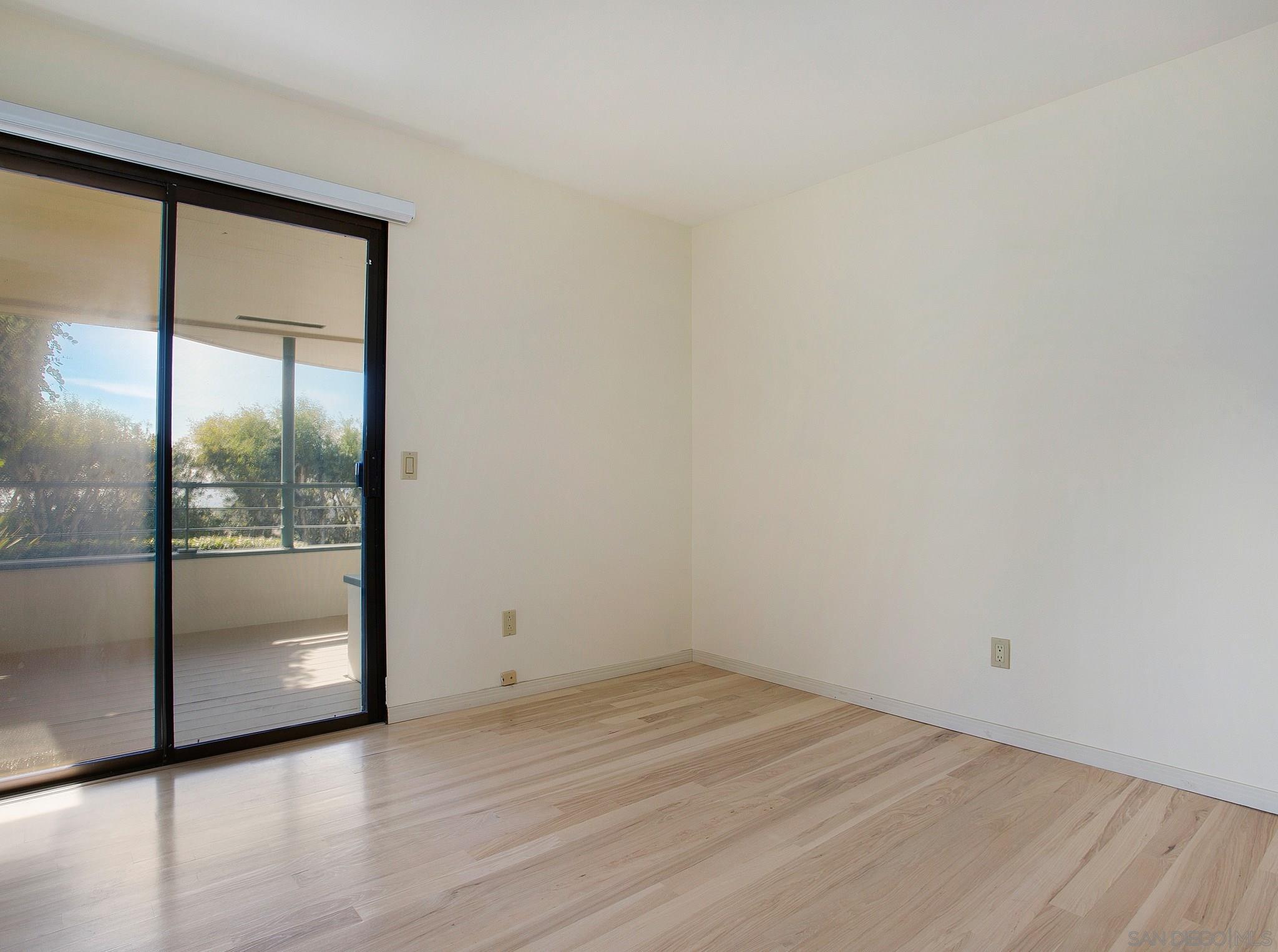 560 Torrey Point Road Del Mar, CA 92014 - Photo 19 of 25 a view of an empty room with wooden floor and a window
