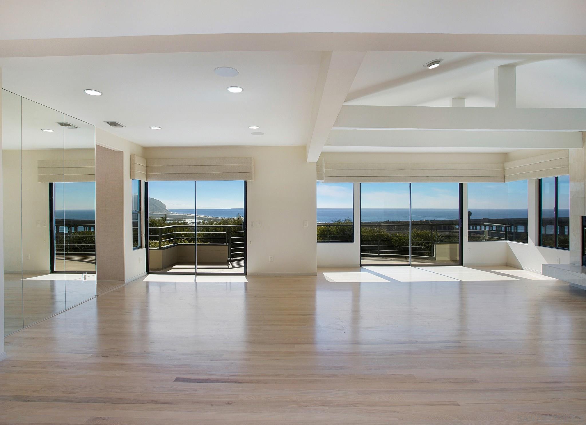 560 Torrey Point Road Del Mar, CA 92014 - Photo 7 of 25 a view of a hallway with wooden floor