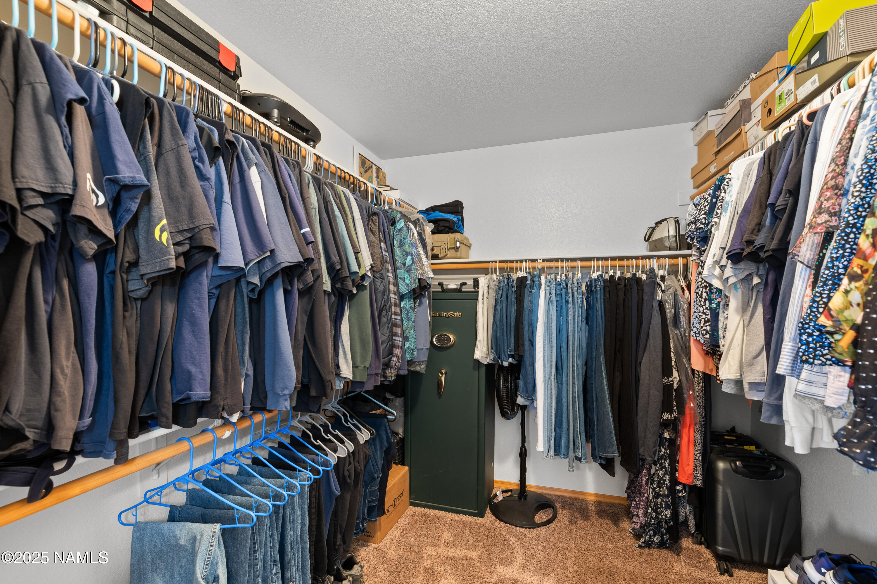 9662 North Aldrich Road Flagstaff, AZ 86004 - Photo 16 of 33 a view of walk in closet with clothes