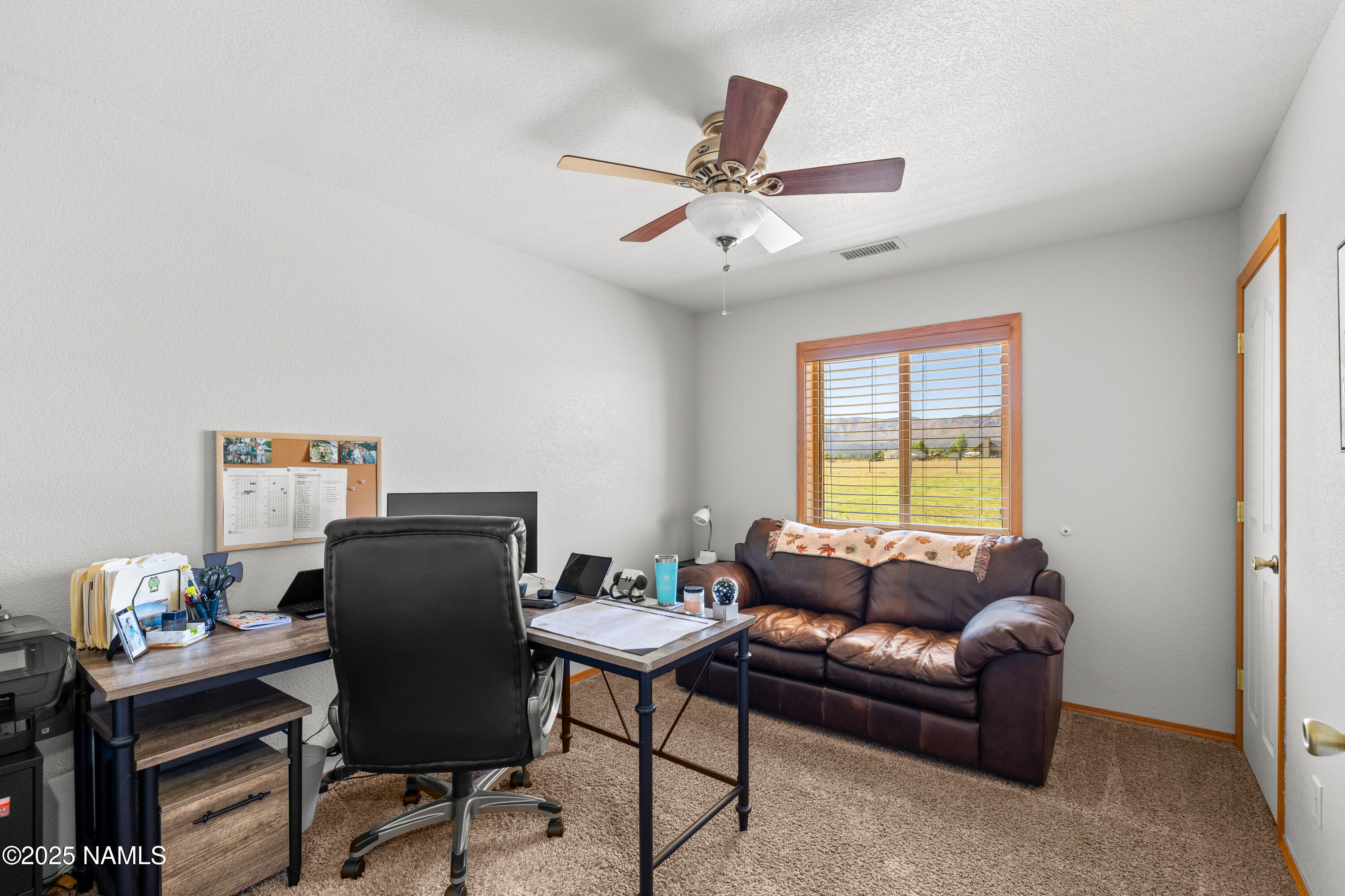 9662 North Aldrich Road Flagstaff, AZ 86004 - Photo 17 of 33 a living room with furniture and a window