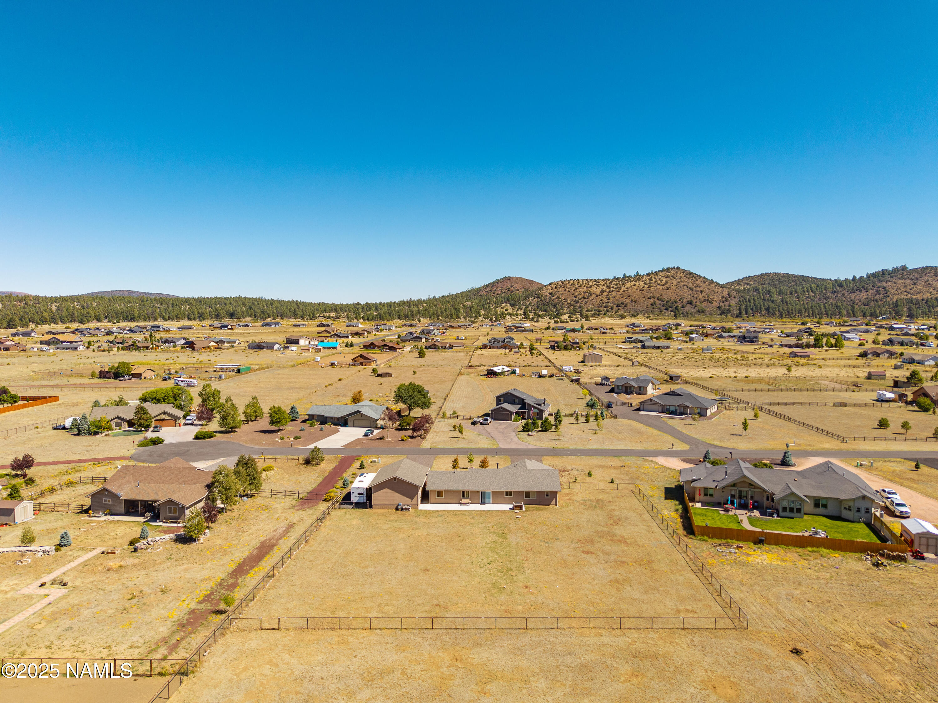 9662 North Aldrich Road Flagstaff, AZ 86004 - Photo 23 of 33 an aerial view of residential houses with outdoor space