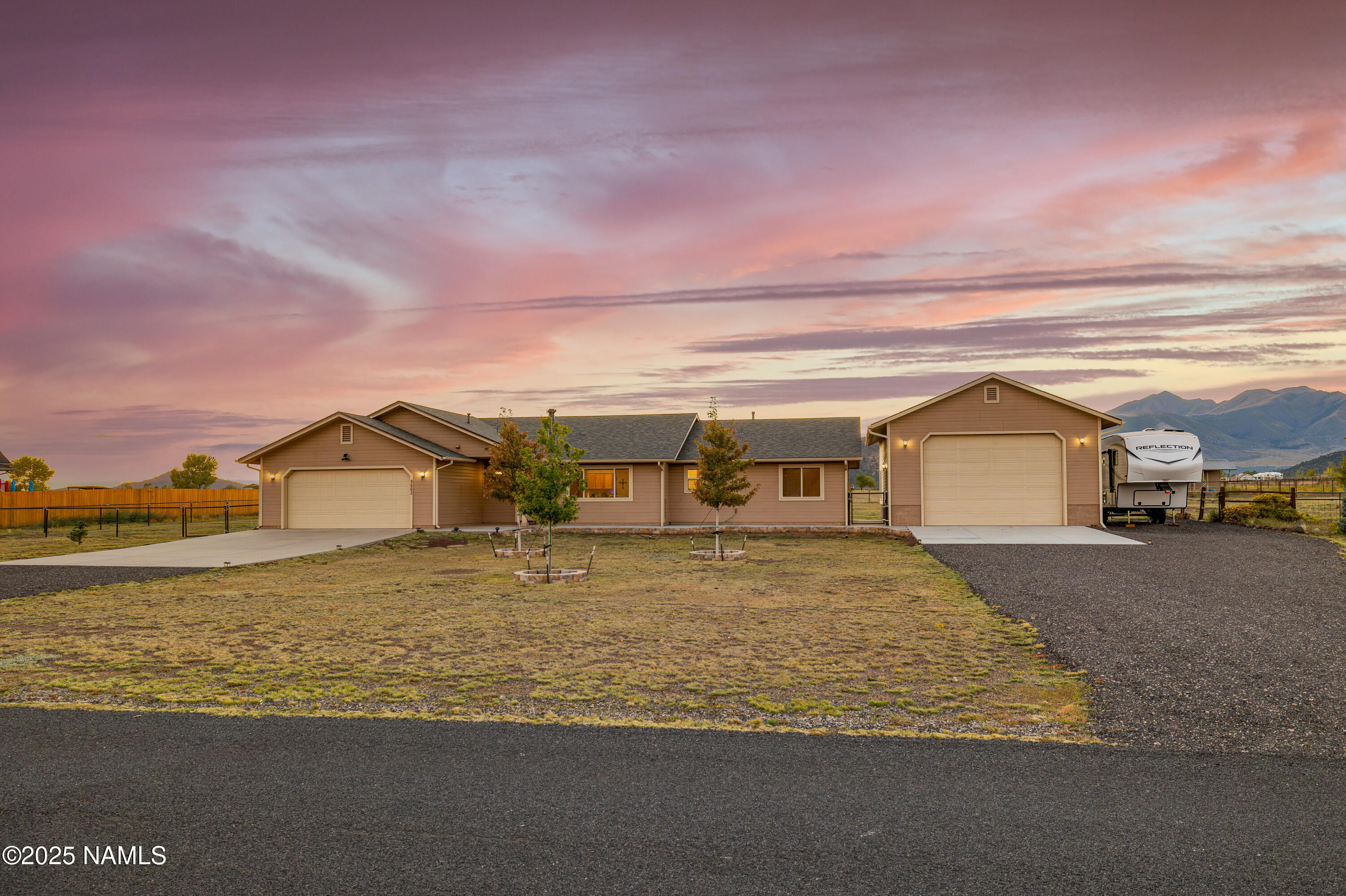 9662 North Aldrich Road Flagstaff, AZ 86004 - Photo 30 of 33 a view of big house with a big yard and large trees