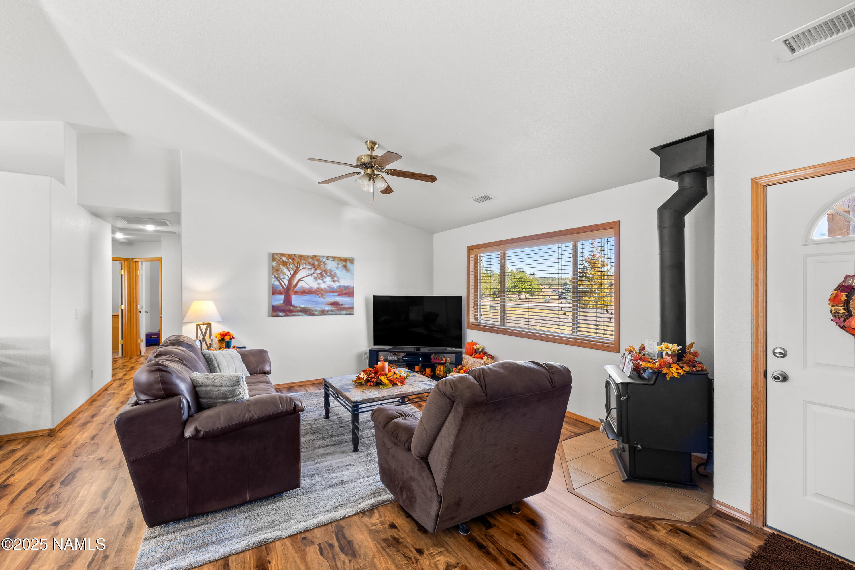 9662 North Aldrich Road Flagstaff, AZ 86004 - Photo 4 of 33 a living room with furniture and a flat screen tv