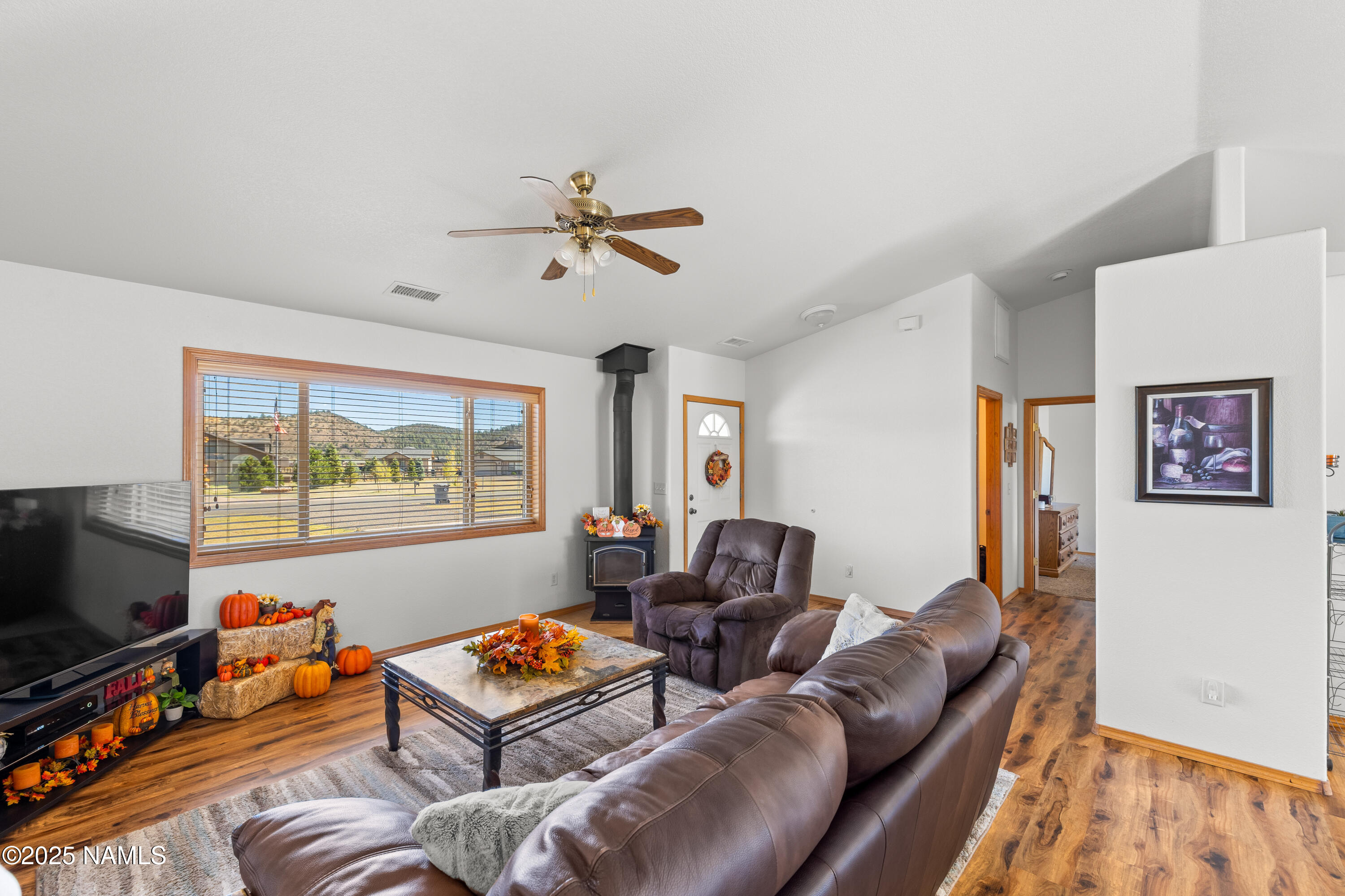 9662 North Aldrich Road Flagstaff, AZ 86004 - Photo 5 of 33 a living room with furniture and a flat screen tv