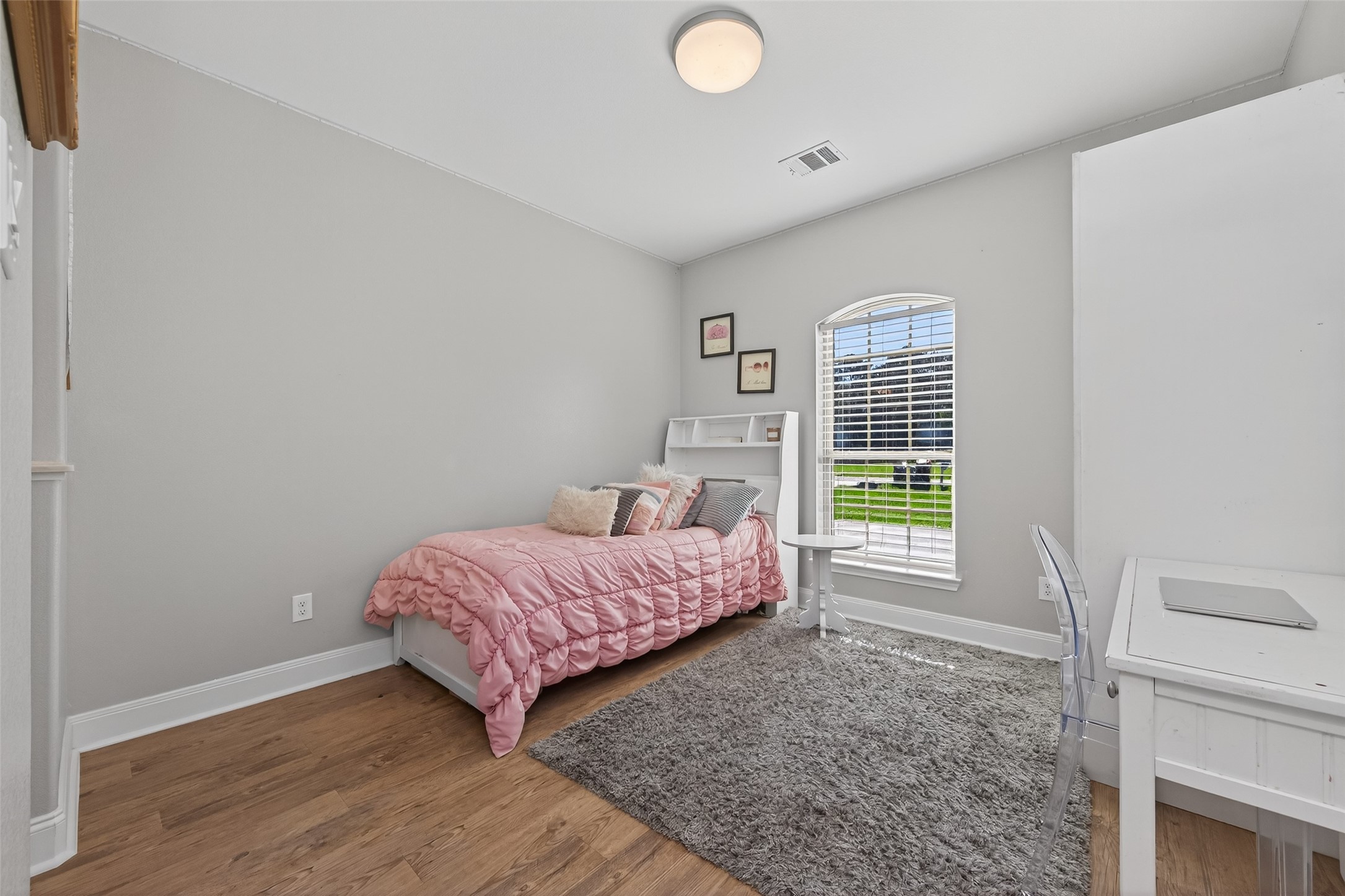 19477 Lazy Lane Porter, TX 77365 - Photo 15 of 26 a bedroom with a bed and a window