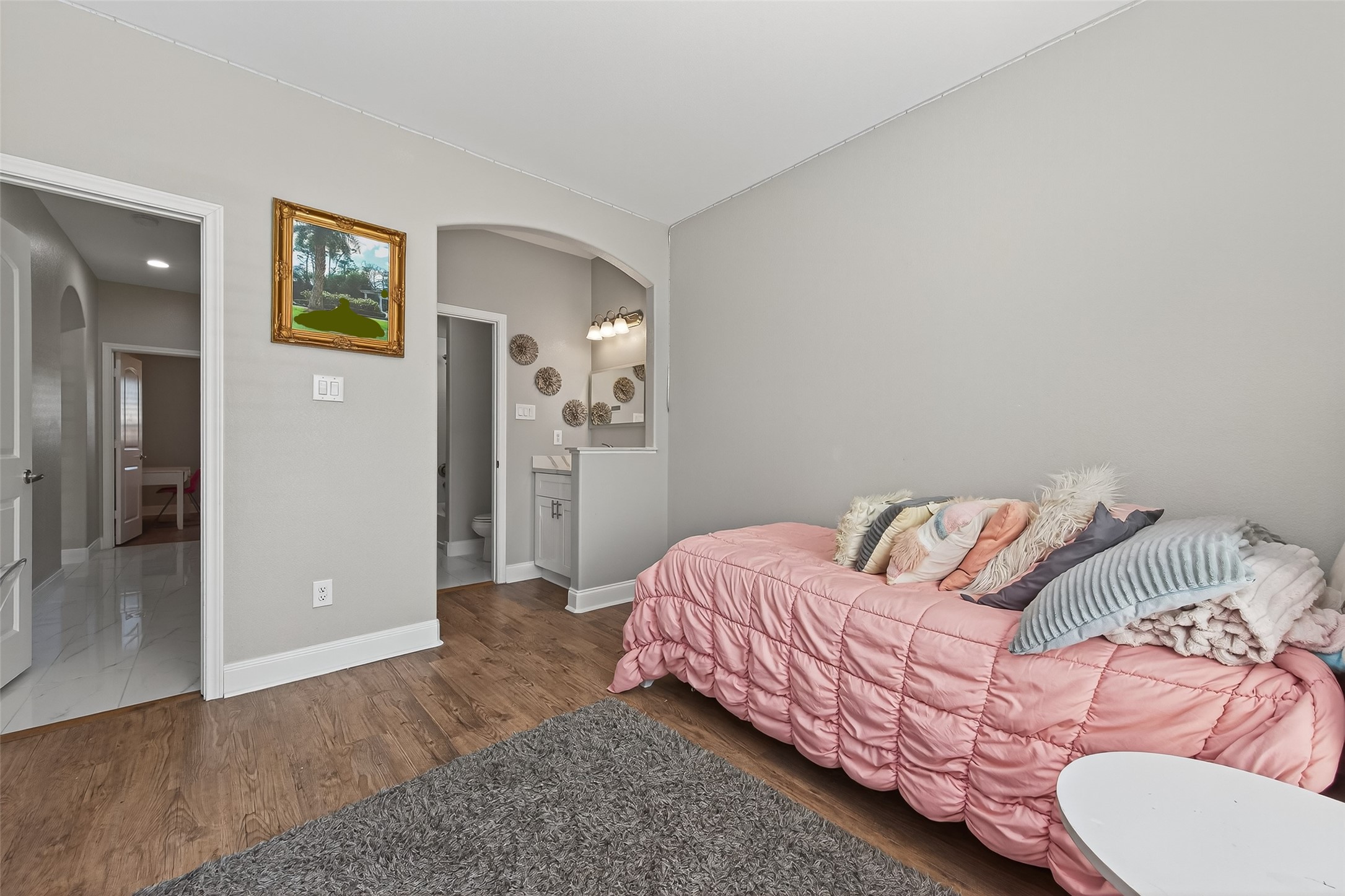 19477 Lazy Lane Porter, TX 77365 - Photo 16 of 26 a bedroom with a bed and painting on the wall