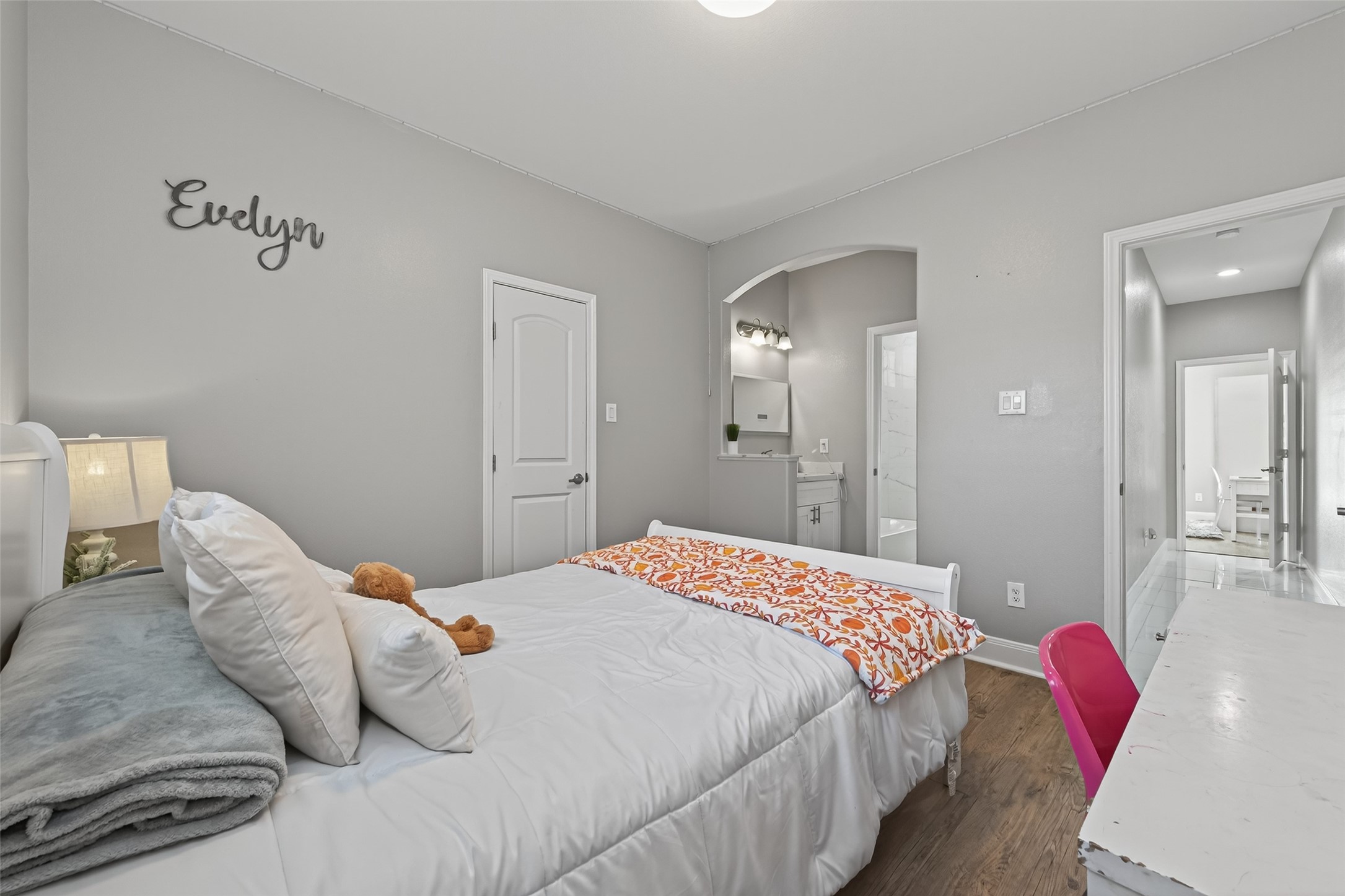 19477 Lazy Lane Porter, TX 77365 - Photo 21 of 26 a bedroom with a bed and a chandelier