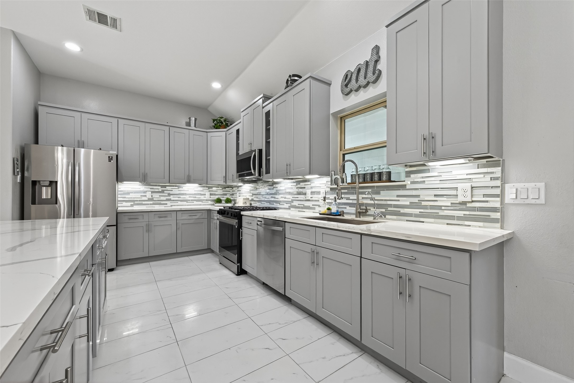 19477 Lazy Lane Porter, TX 77365 - Photo 5 of 26 a kitchen with a sink cabinets and stainless steel appliances