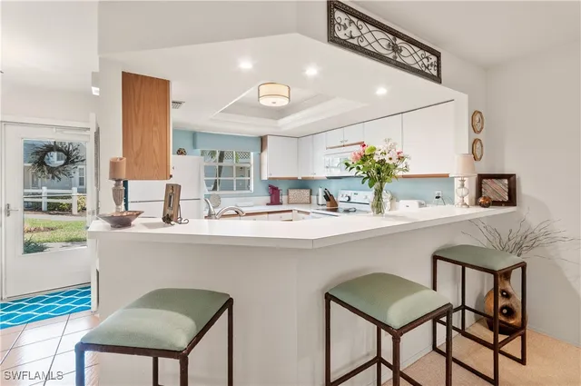 a kitchen with a table and chairs in it