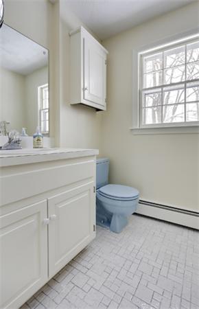 50 Sawmill Road North Andover, MA 01845 - Photo 20 of 25 a bathroom with a toilet sink and mirror