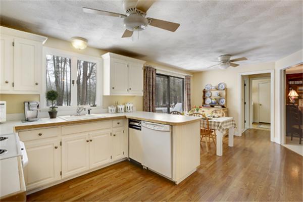 50 Sawmill Road North Andover, MA 01845 - Photo 3 of 25 a large white kitchen with cabinets a sink and appliances