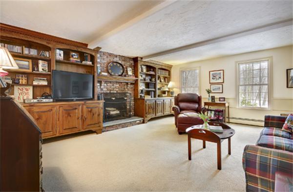 50 Sawmill Road North Andover, MA 01845 - Photo 8 of 25 a living room with furniture a flat screen tv and large window