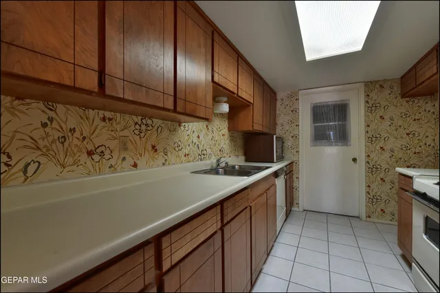a kitchen with a sink and cabinets