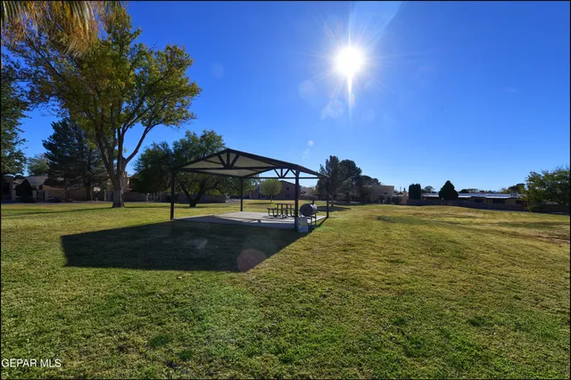 a view of a swimming pool with an outdoor space and seating area