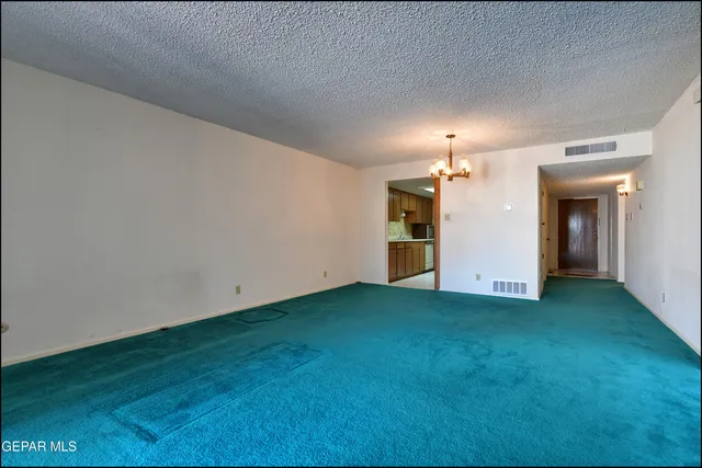 a view of a kitchen with a sink and a fireplace