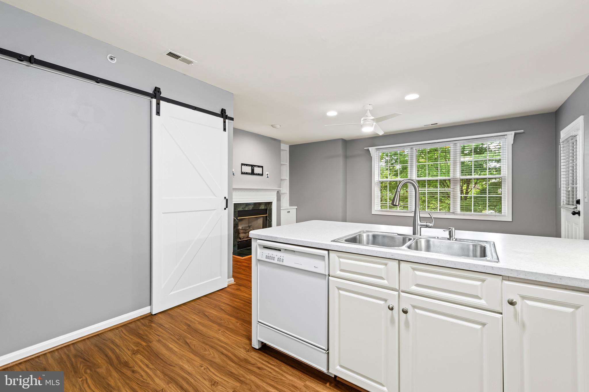 12204 Burncourt Road, Unit 302 Lutherville-Timonium, MD 21093 - Photo 13 of 27 a kitchen with a sink and a window