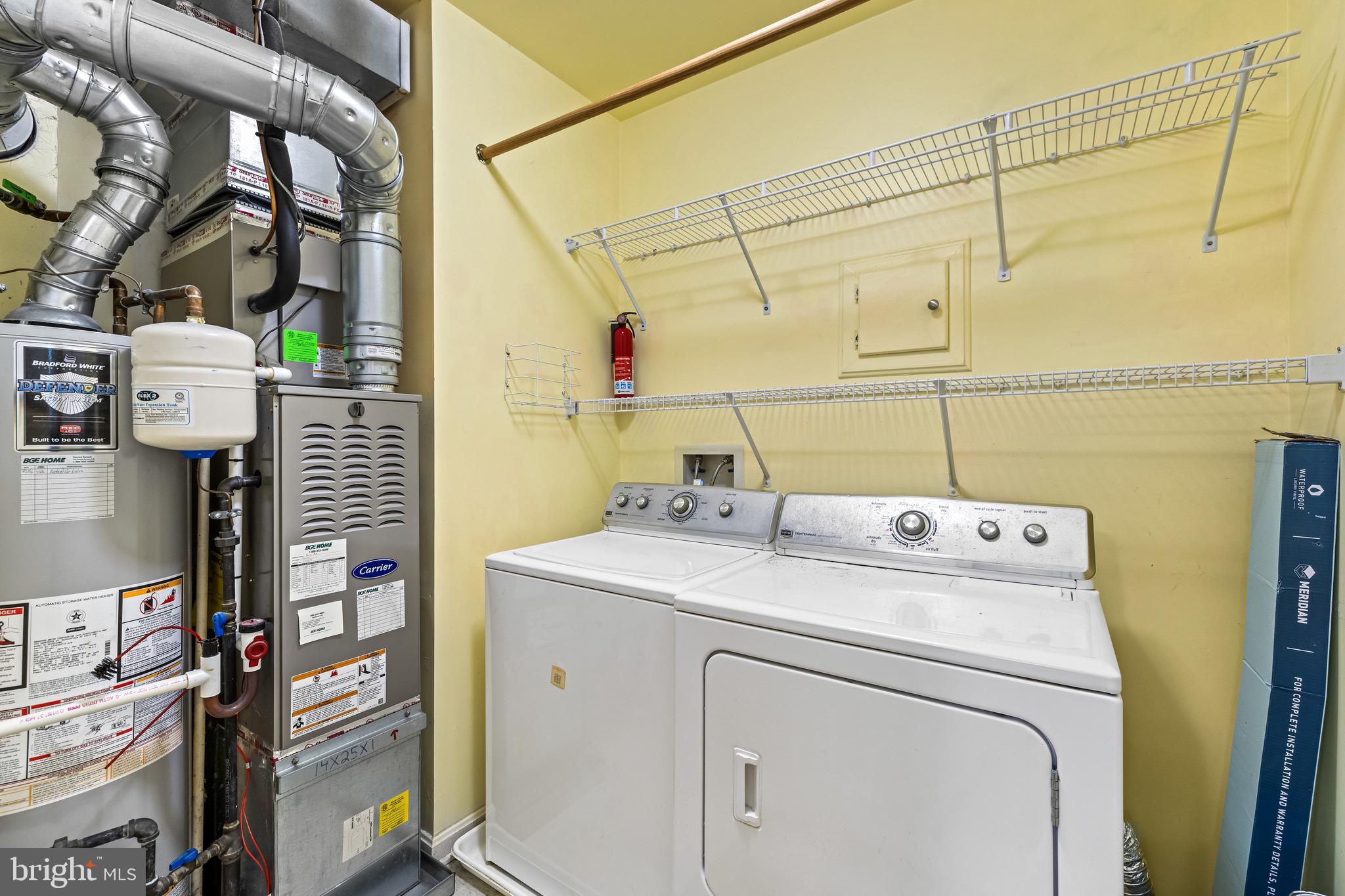 12204 Burncourt Road, Unit 302 Lutherville-Timonium, MD 21093 - Photo 15 of 27 a utility room with dryer and washer