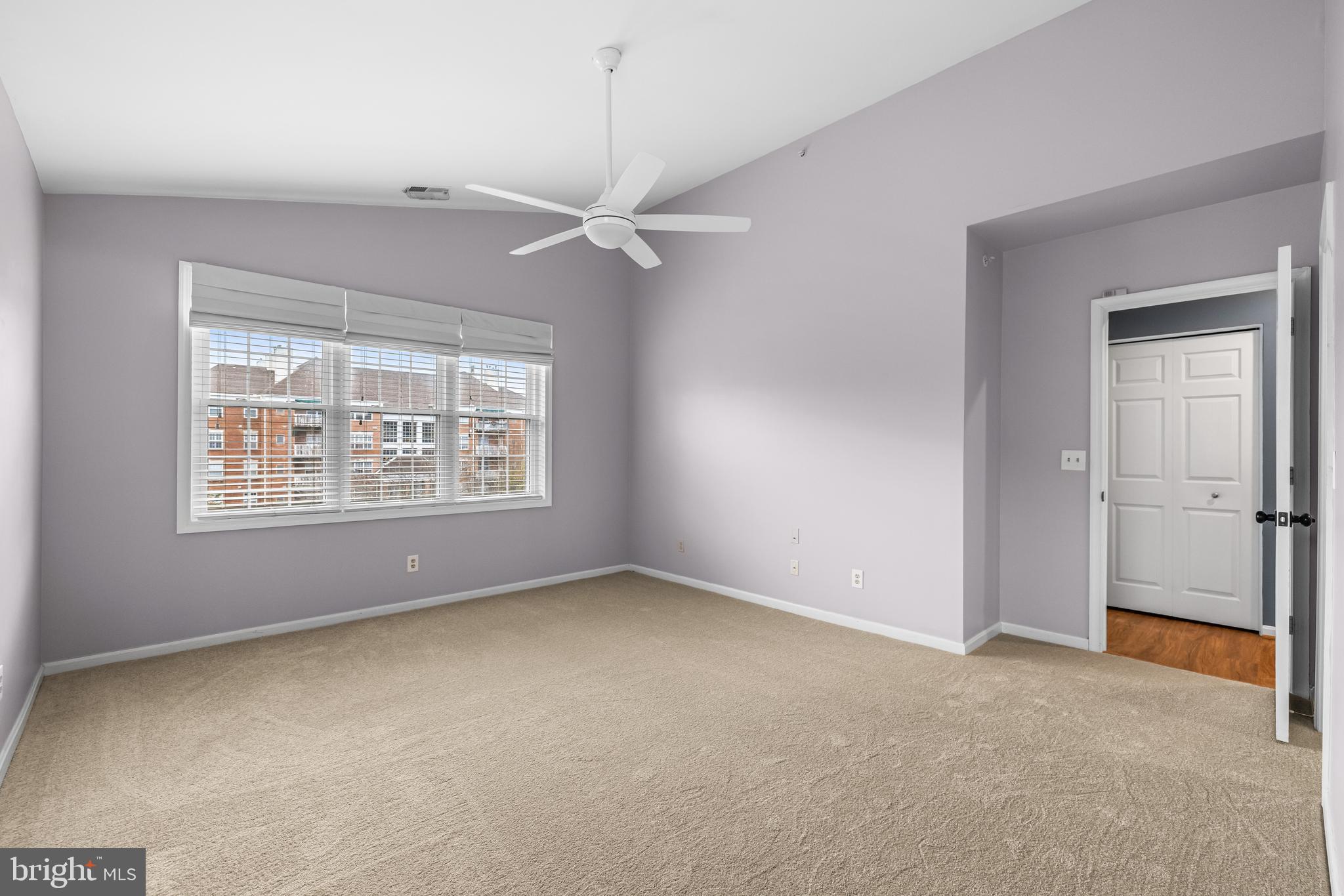 12204 Burncourt Road, Unit 302 Lutherville-Timonium, MD 21093 - Photo 19 of 27 an empty room with a window and ceiling fan