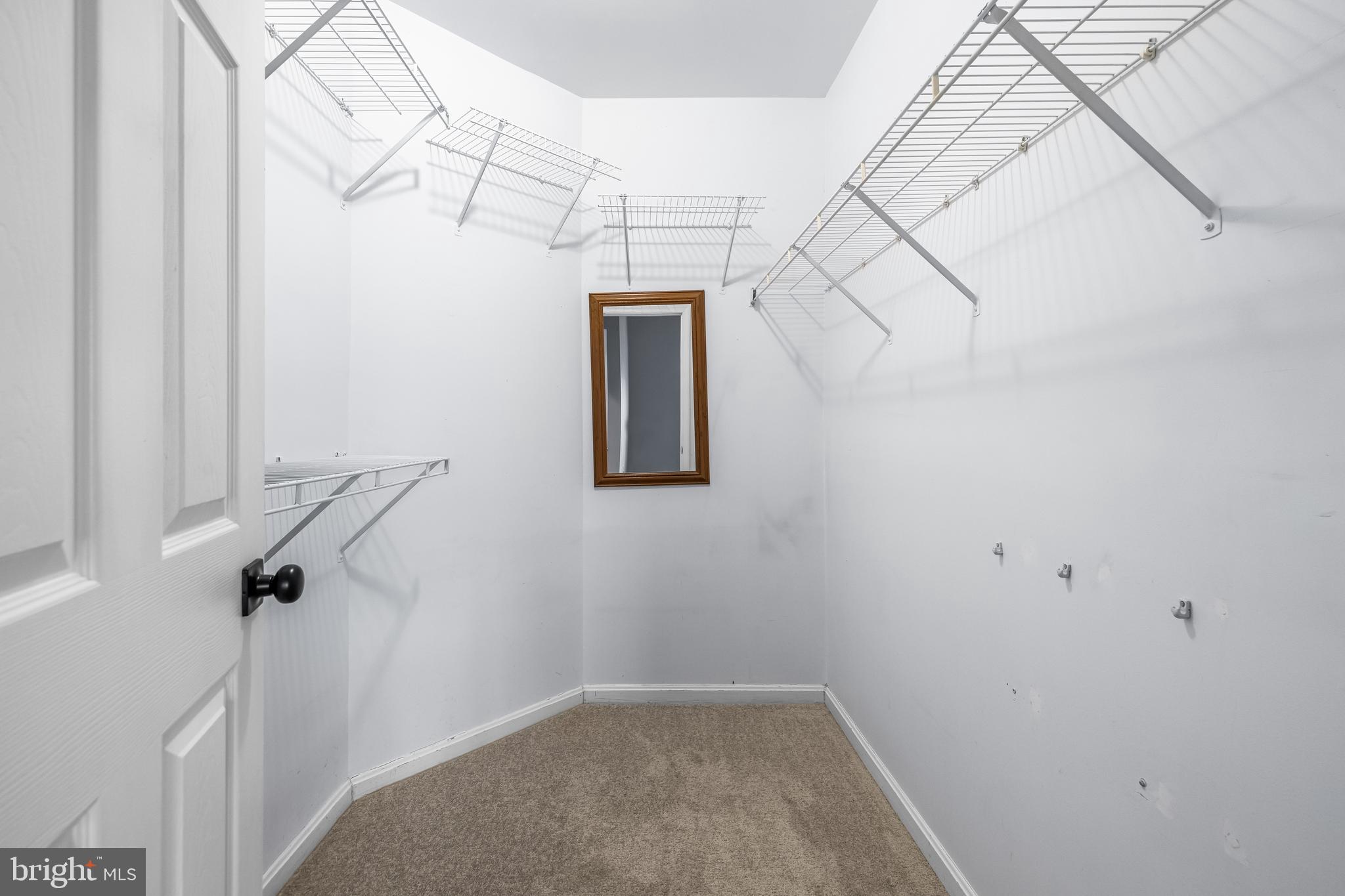 12204 Burncourt Road, Unit 302 Lutherville-Timonium, MD 21093 - Photo 21 of 27 a view of a room with rack on the wall