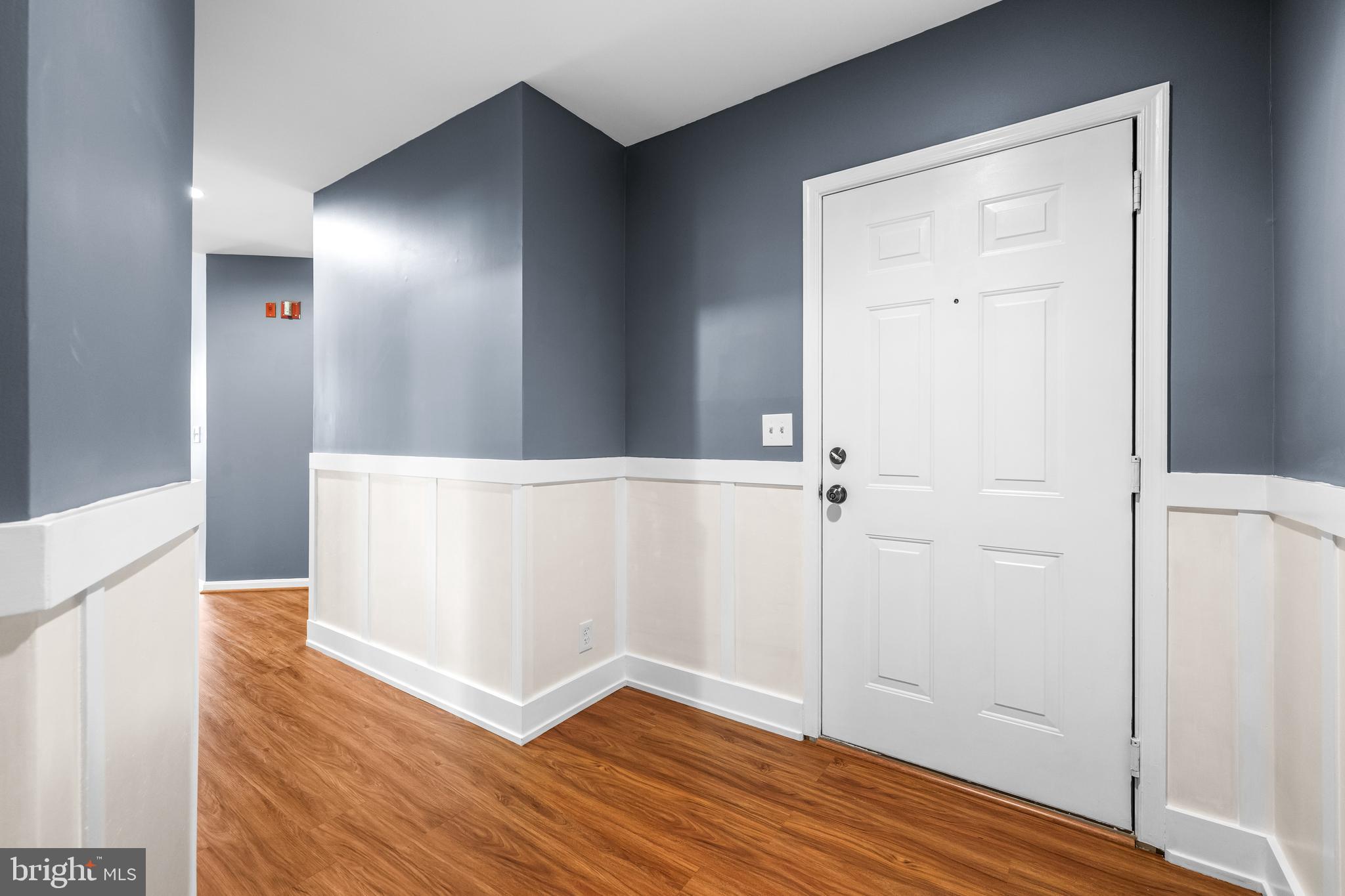 12204 Burncourt Road, Unit 302 Lutherville-Timonium, MD 21093 - Photo 3 of 27 an empty room with wooden floor