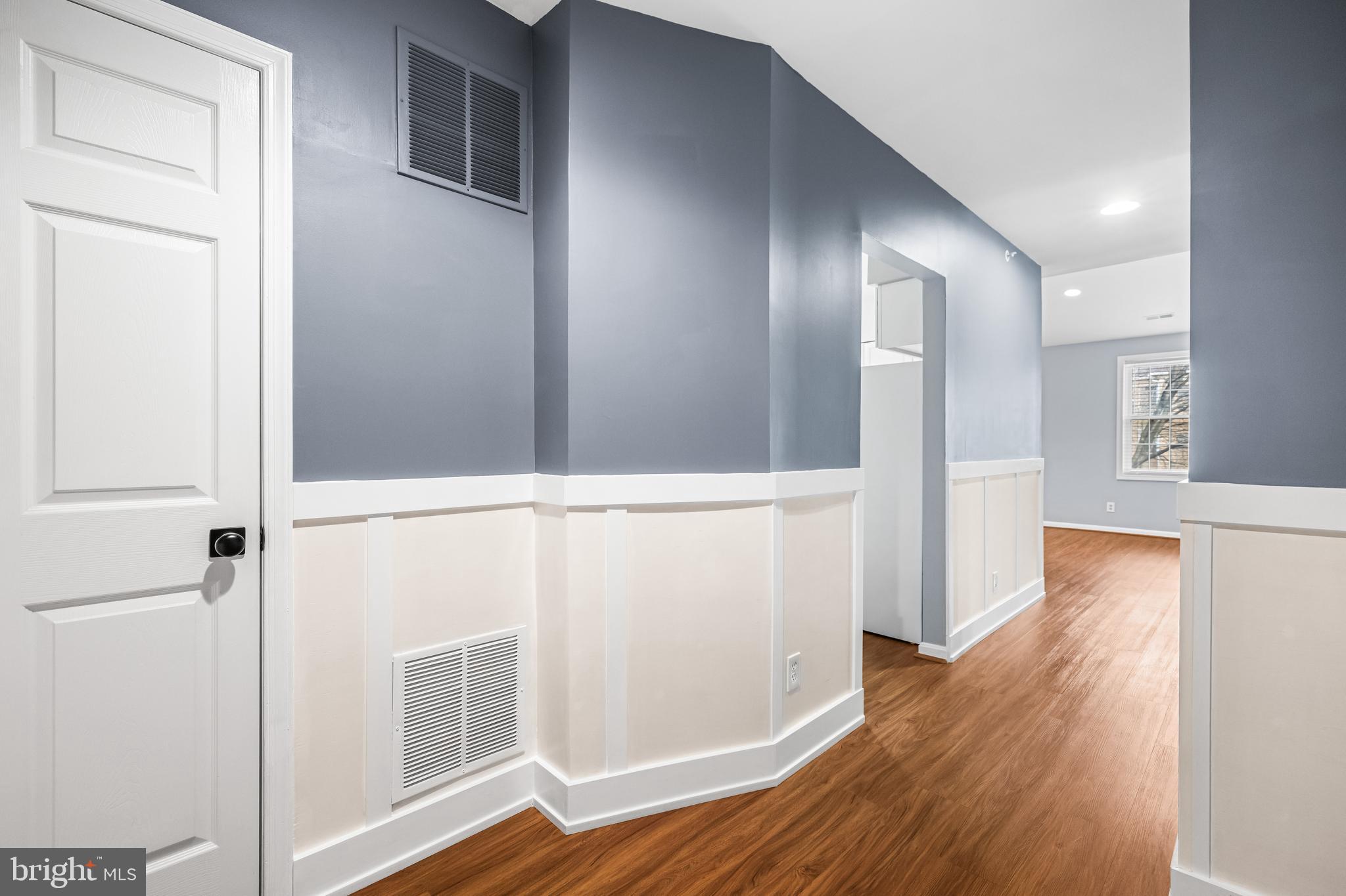 12204 Burncourt Road, Unit 302 Lutherville-Timonium, MD 21093 - Photo 4 of 27 a view of walk in closet with wooden floor