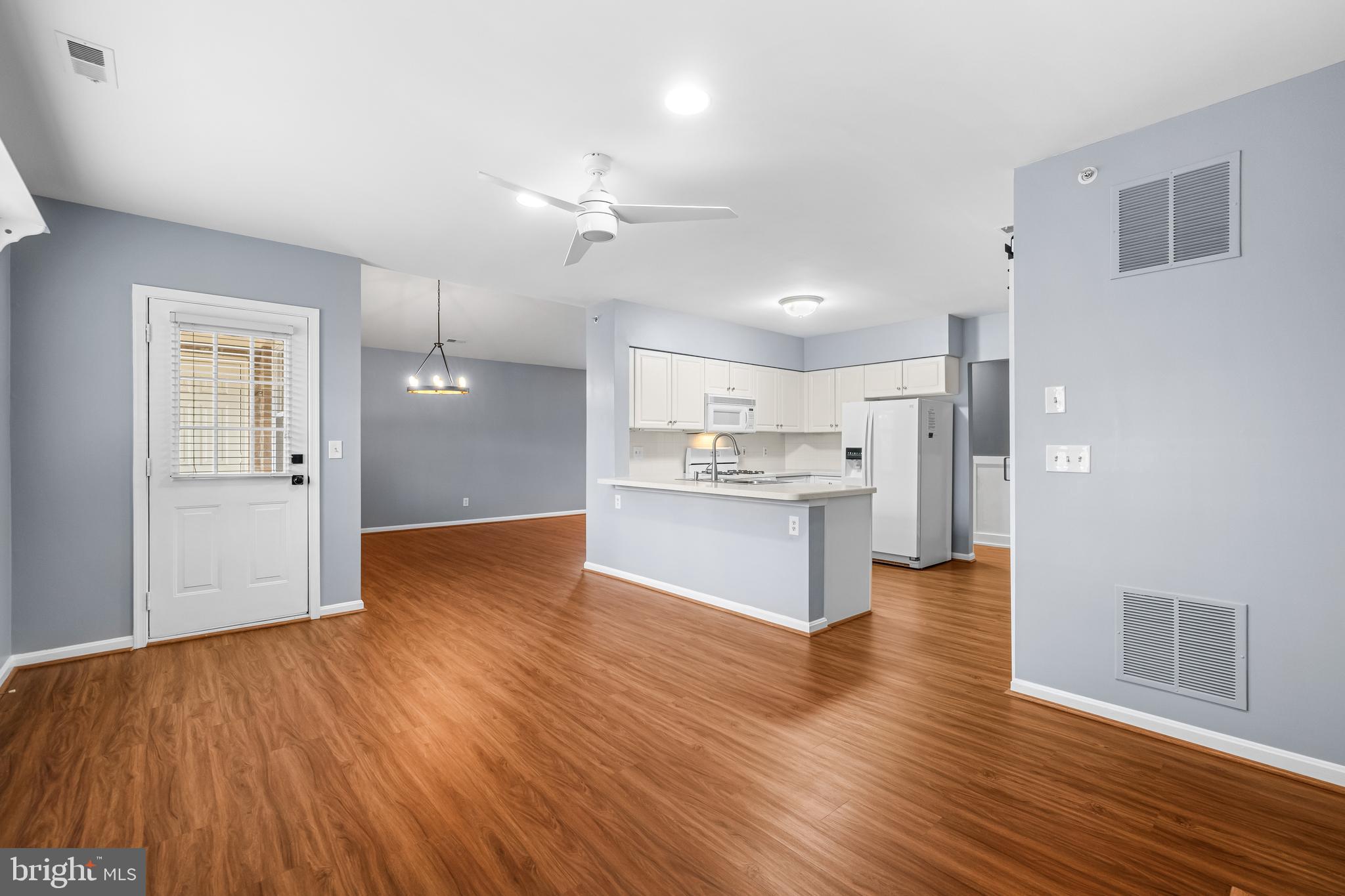 12204 Burncourt Road, Unit 302 Lutherville-Timonium, MD 21093 - Photo 5 of 27 a view of kitchen with wooden floor
