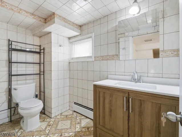 a bathroom with a toilet and bathtub