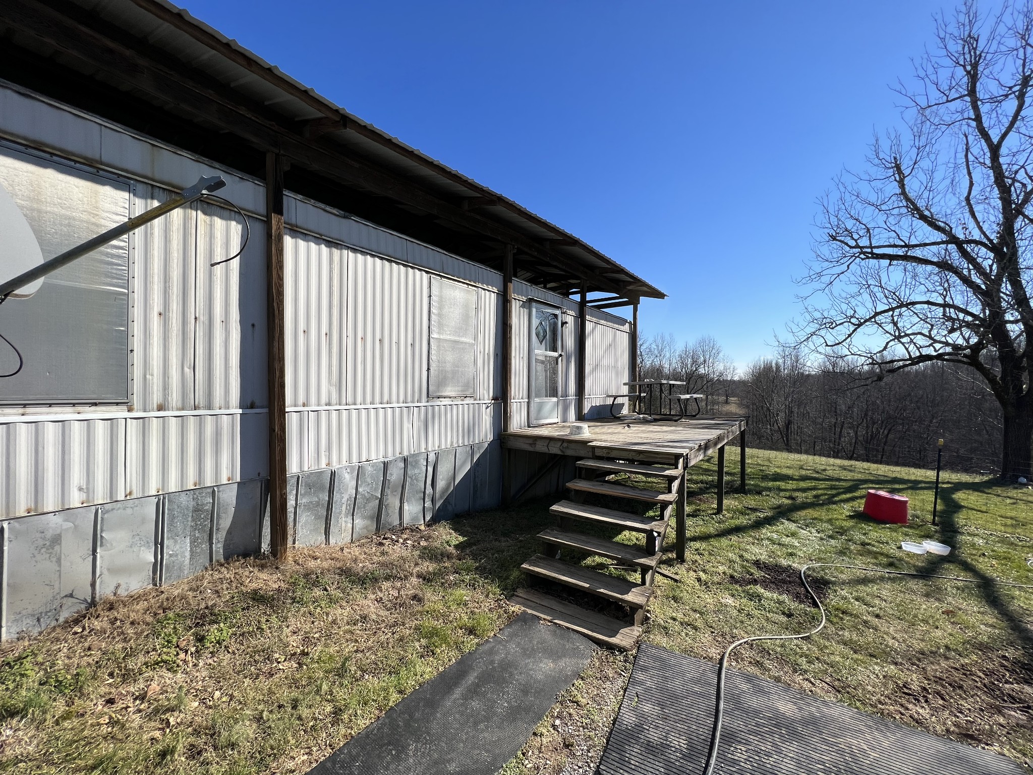 445 Tatum Road Pulaski, TN 38478 - Photo 46 of 68 a backyard of a house with wooden fence and a bench