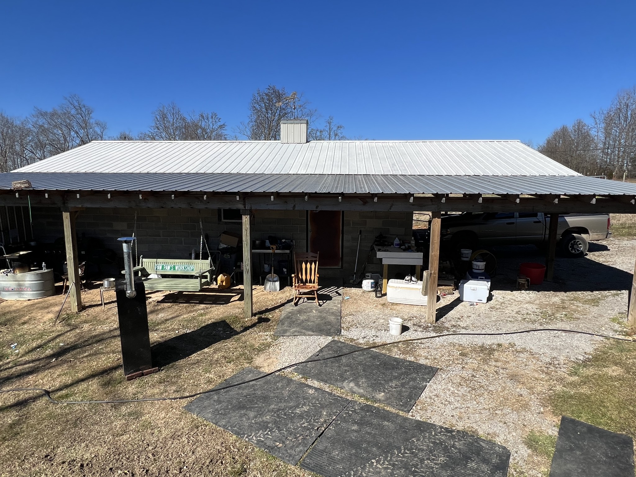 445 Tatum Road Pulaski, TN 38478 - Photo 68 of 68 a view of a patio with table and chairs under an umbrella