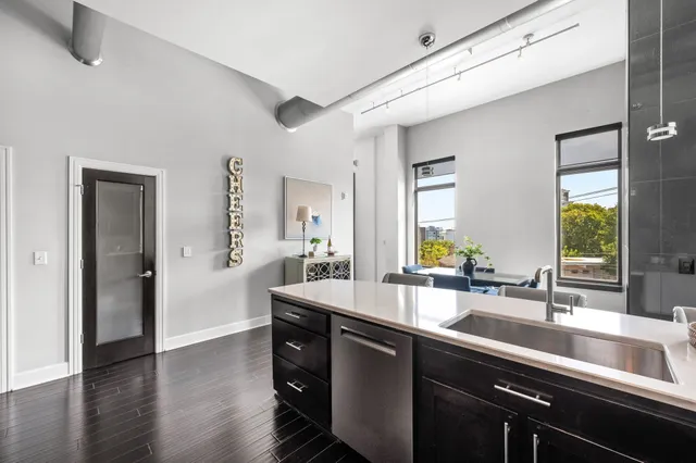 a dining room with furniture and wooden floor