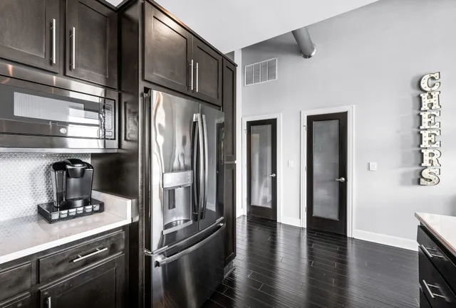 a dining room with furniture and wooden floor