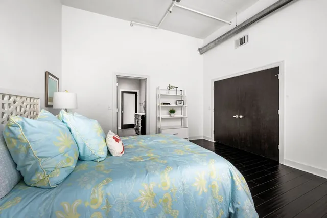 a view of a balcony with a floor to ceiling window and wooden fence