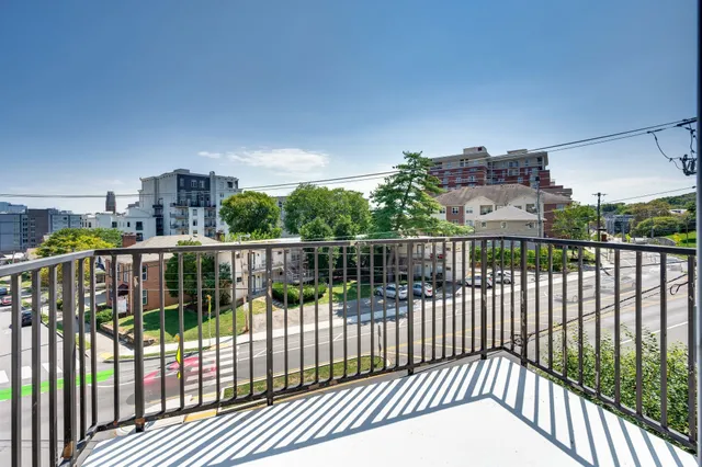 a lobby with furniture and a chandelier