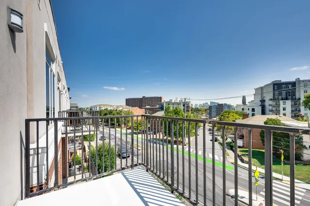 a lobby with furniture and a large window
