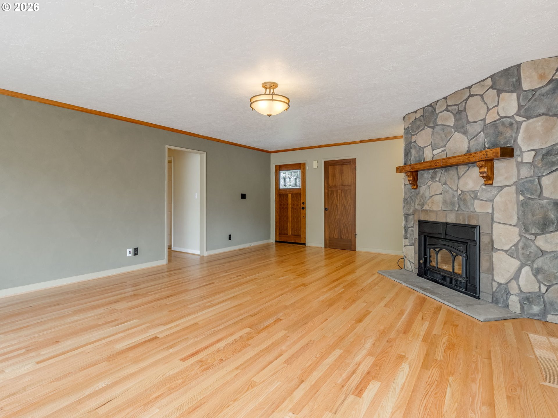 48140 Southeast Linhart Butte Road Sandy, OR 97055 - Photo 15 of 47 a view of empty room with wooden floor and fan
